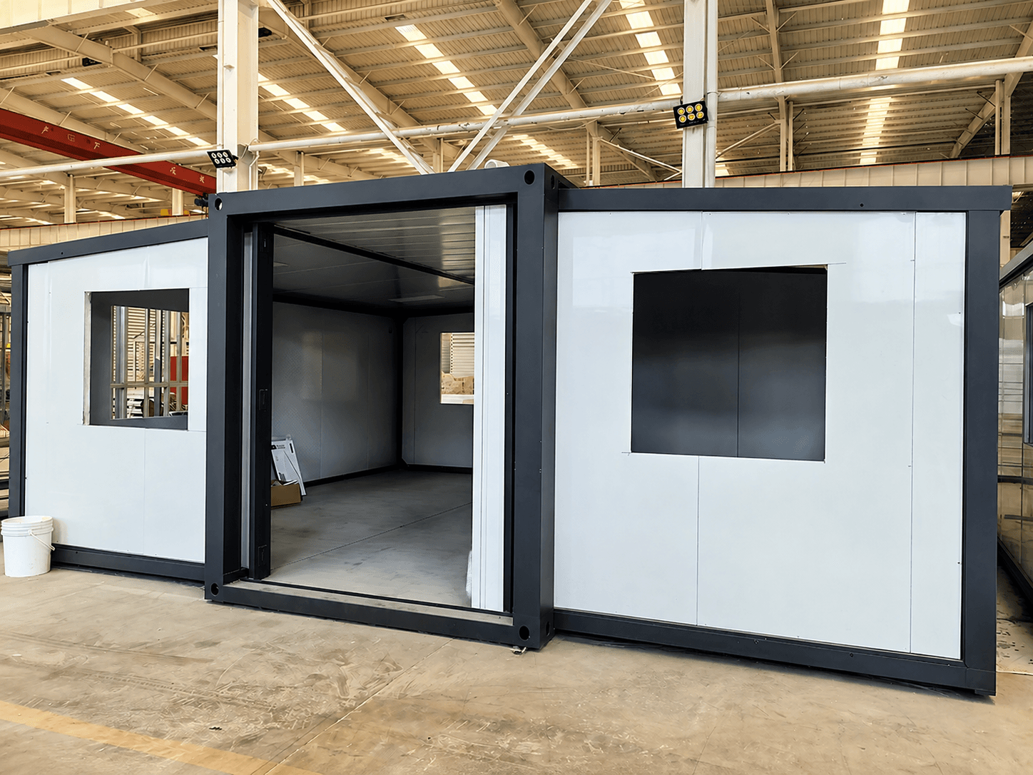 Modular building formed from expandable container modules